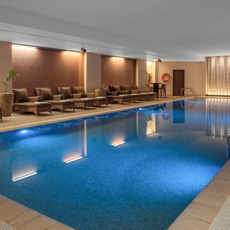 Doubletree By Hilton La Torre Golf Resort Roldán Kültér fotó The swimming pool at the hotel