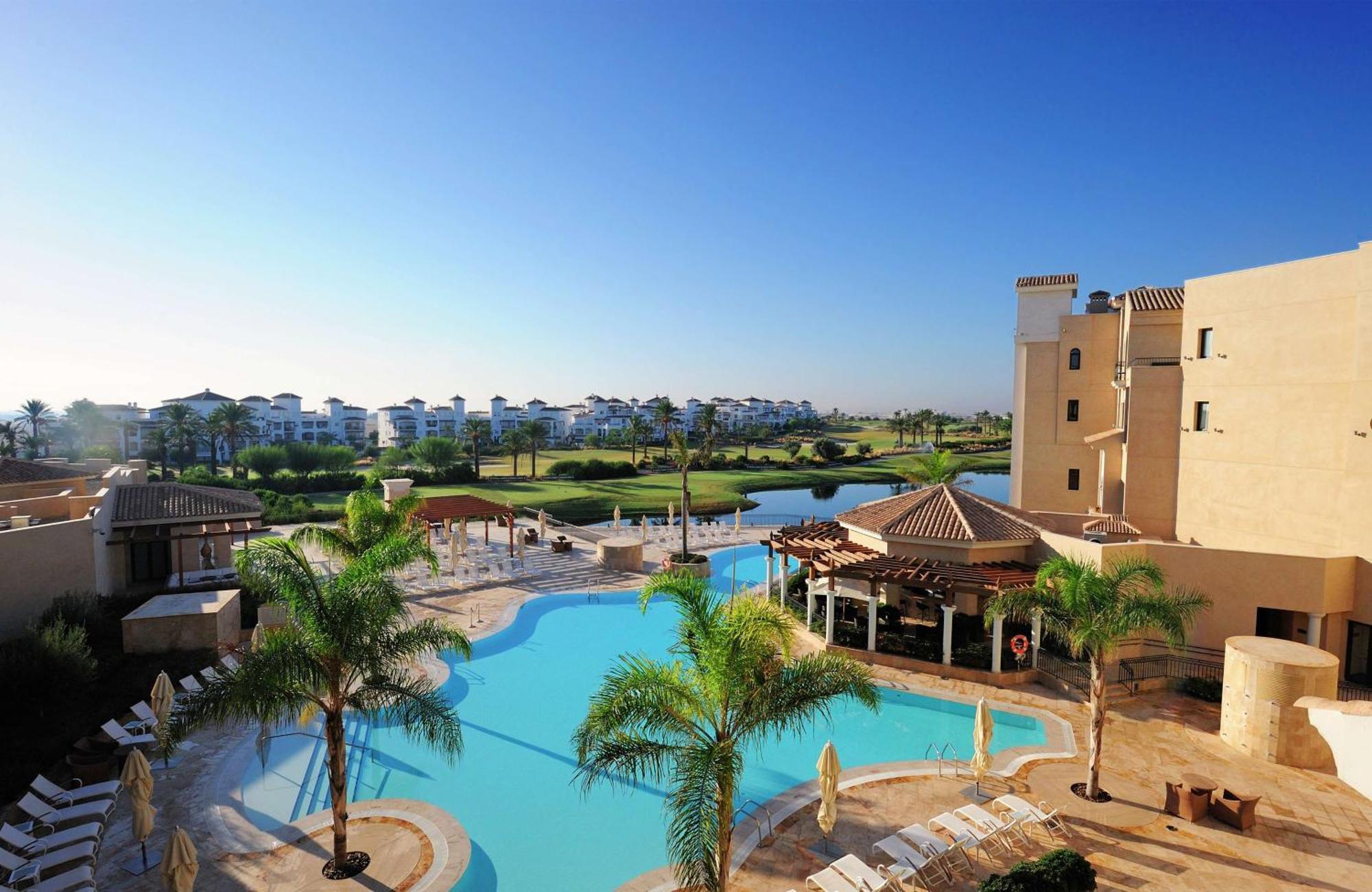 Doubletree By Hilton La Torre Golf Resort Roldán Kültér fotó View of the pool at the clubhouse
