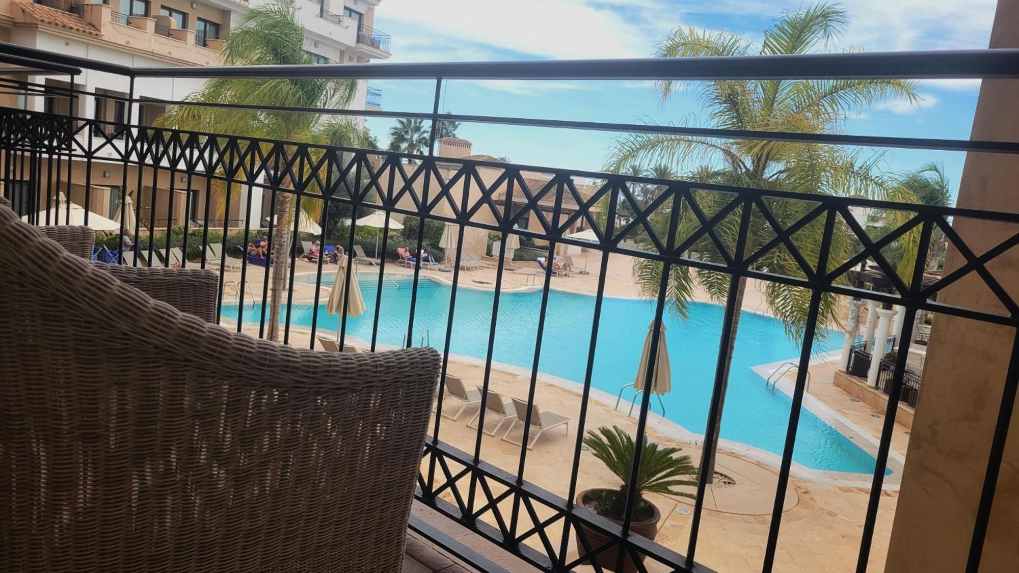 Doubletree By Hilton La Torre Golf Resort Roldán Kültér fotó View of the pool at the hotel