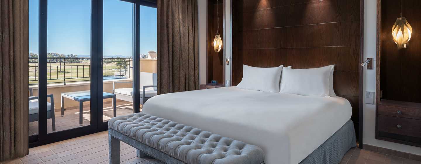 Doubletree By Hilton La Torre Golf Resort Roldán Kültér fotó A bedroom at the hotel